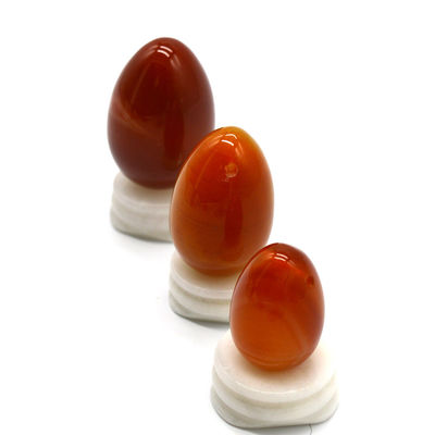 OEM ODM Accepté œufs de cornélien rouge Yoni œufs de pierre semi-précieuse Percé style de massage