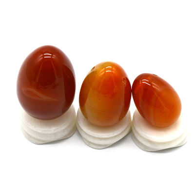 OEM ODM Accepté œufs de cornélien rouge Yoni œufs de pierre semi-précieuse Percé style de massage