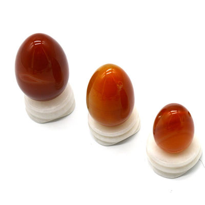 OEM ODM Accepté œufs de cornélien rouge Yoni œufs de pierre semi-précieuse Percé style de massage