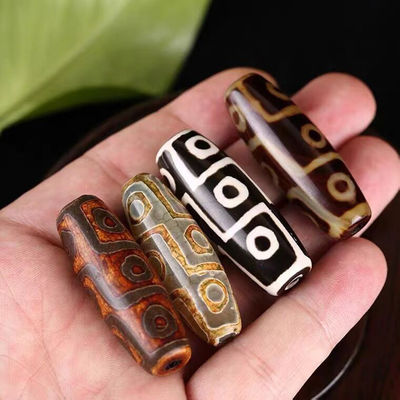 Technique Polissage de pierre précieuse naturelle en vrac Tibétain 9Oeil Dzi Perle 40mm Agate Barrel Perles pour bijoux