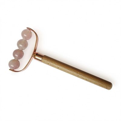 Masseur facial portable rose quartz à tête unique anti-rides rouleau de poignée en bois