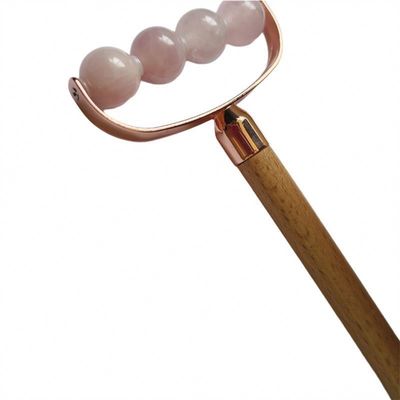 Masseur facial portable rose quartz à tête unique anti-rides rouleau de poignée en bois