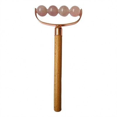 Masseur facial portable rose quartz à tête unique anti-rides rouleau de poignée en bois