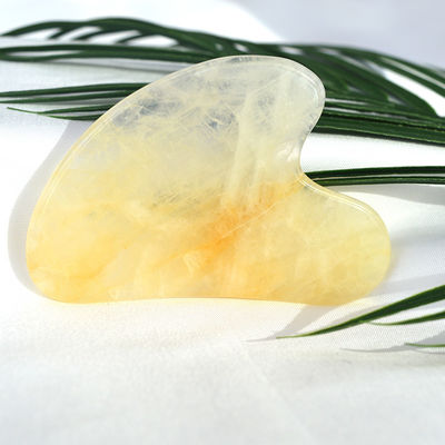 Tableau de grattage en forme de cœur naturel jaune citrine gua sha pour l'instrument de massage du visage et du corps