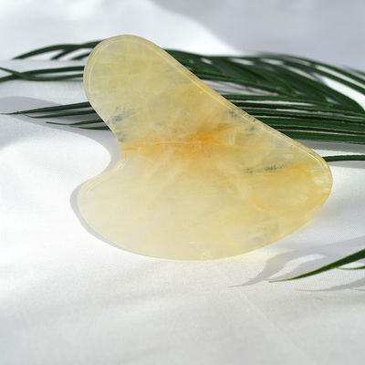 Tableau de grattage en forme de cœur naturel jaune citrine gua sha pour l'instrument de massage du visage et du corps