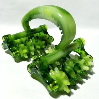 Appareil de massage à rouleaux en plastique avec poignée pour le massage facial.