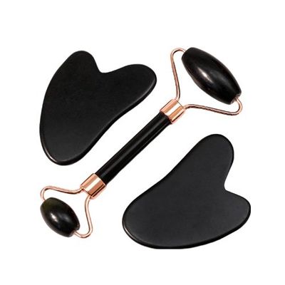 Un grattoir pour le corps personnalisé avec un logo disponible. Un rouleau de massage facial en pierre blanche noire naturelle. Un rouleau de massage en jade noir.