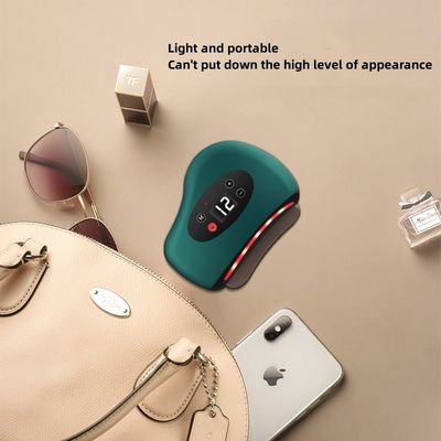 Massage corporel Grâce à l'électricité verte, le Guasha est utilisé pour la physiothérapie, la santé, la drague, le traitement du méridien, l'outil de relaxation.