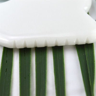 Propriétés de l'équipement de massage corporel naturel de jade blanc de pierre blanche Gua Sha outil de grattage pour le massage de soins de santé du corps