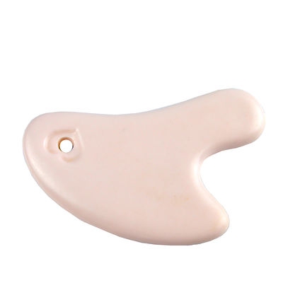 La planche à gratter en céramique en forme de cœur est l'outil idéal pour le massage corporel et le rajeunissement du visage.