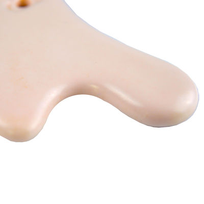 La planche à gratter en céramique en forme de cœur est l'outil idéal pour le massage corporel et le rajeunissement du visage.