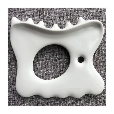 Soulager le stress musculaire et la douleur avec un logo personnalisé Masse à la mâchoire en céramique Gua Sha