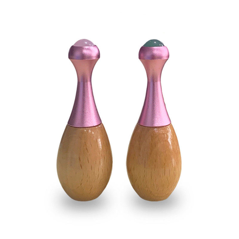 Rouleau de massage en bois à manche de jade, bâton de massage facial Gua Sha et outils de soins oculaires pour favoriser l'absorption de la crème oculaire