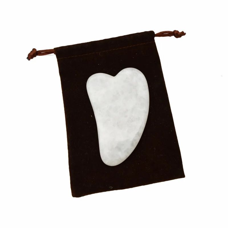 Outil portatif de Gua Sha en jade blanc pour un massage musculaire et des soins de beauté efficaces