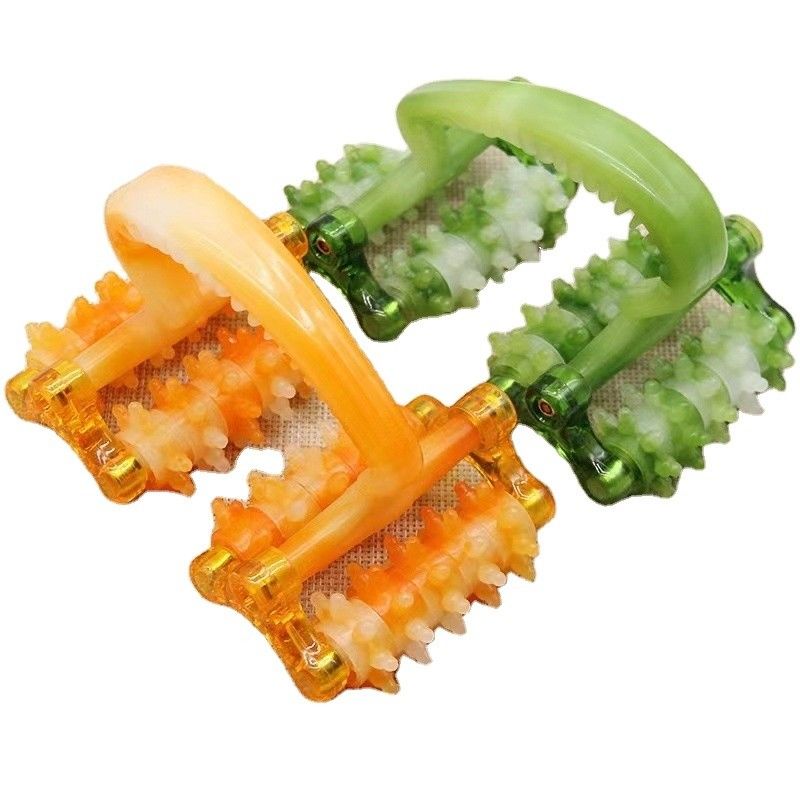 Appareil de massage à rouleaux en plastique avec poignée pour le massage facial.