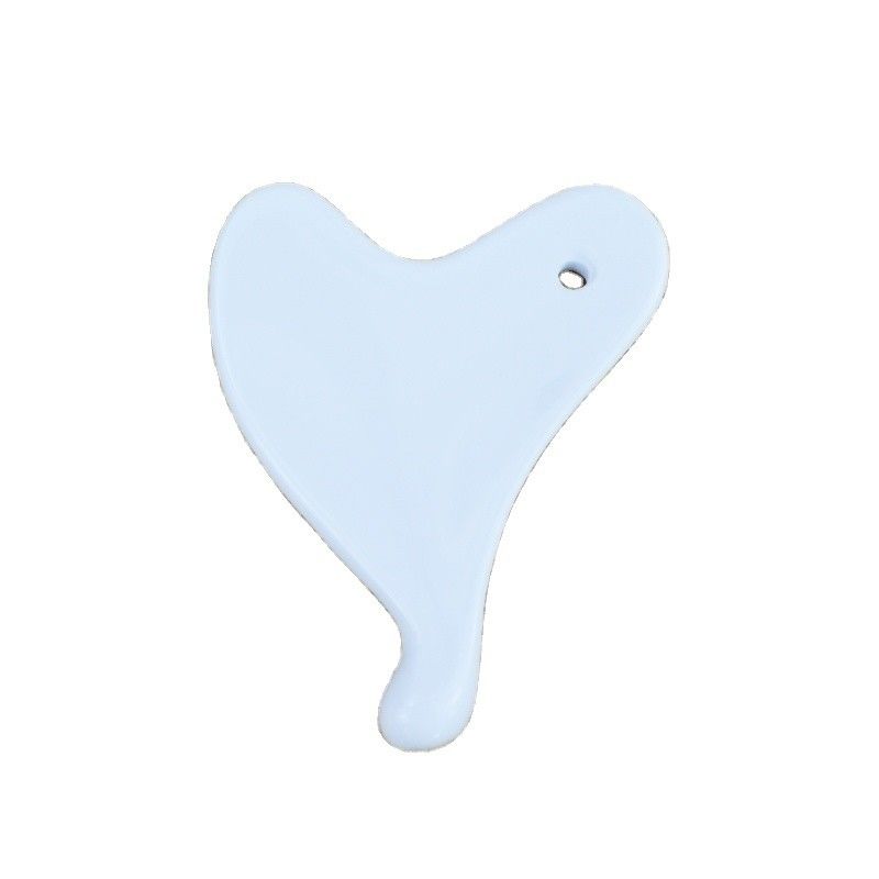 L'outil de massage en céramique mini Gua Sha pour le lifting du visage et la réduction des rides est disponible.