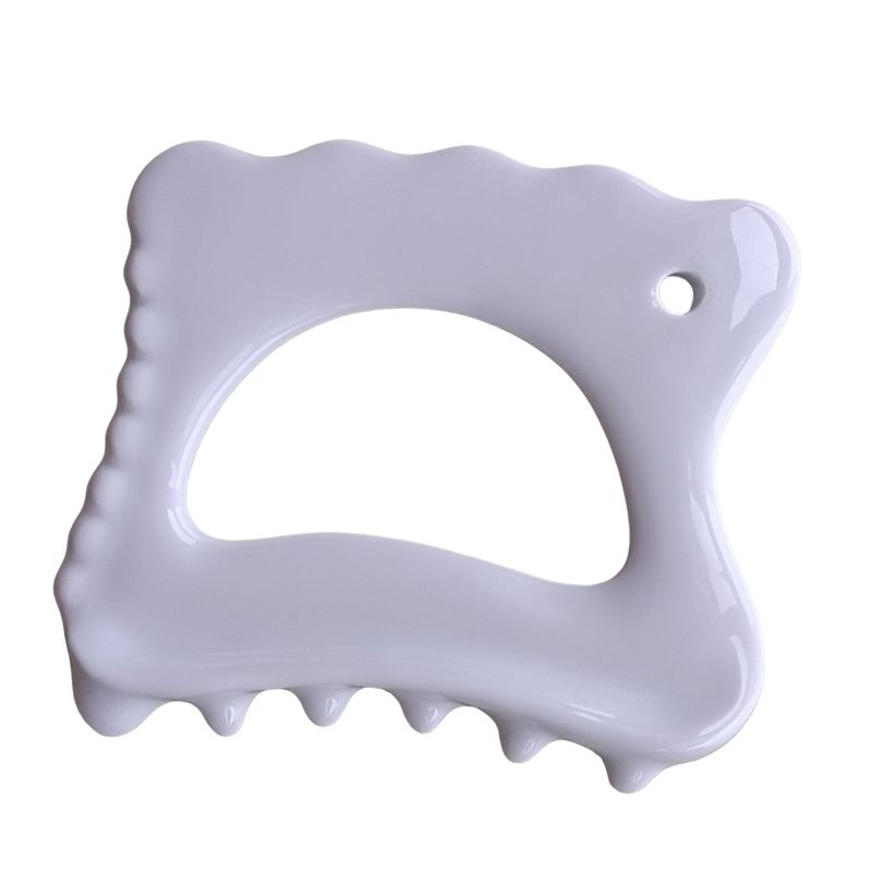 Levé de visage et massage corporel avec l'outil en céramique Gua Sha