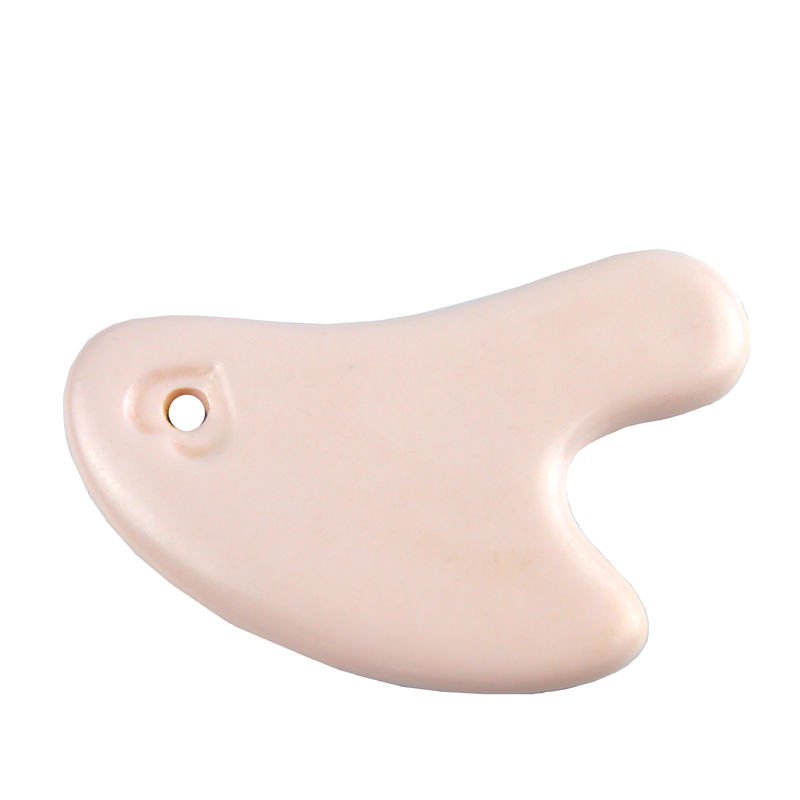 La planche à gratter en céramique en forme de cœur est l'outil idéal pour le massage corporel et le rajeunissement du visage.