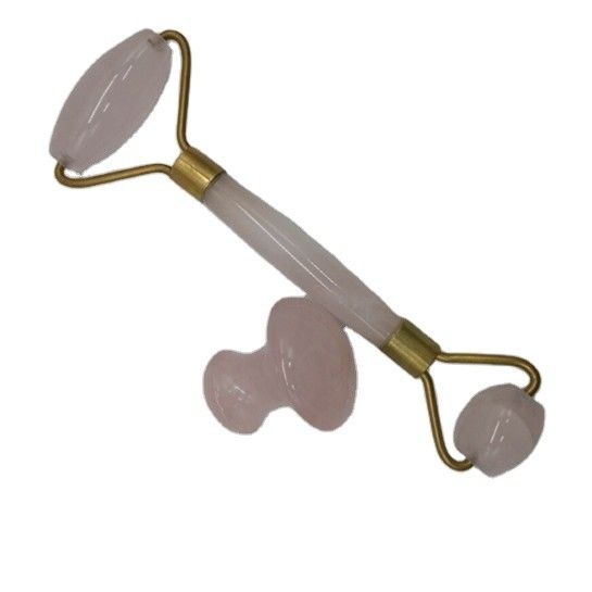 Un ensemble de rouleaux de pierre de jade pour le massage de la peau du visage outil Gua Sha relaxant anti-âge lutte contre les rides quartz rose